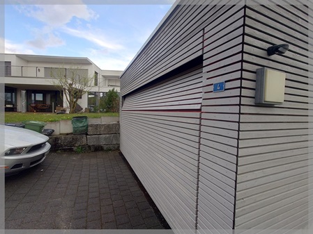 Kubische Carport-Anlage mit Holz-Rhombusschalung